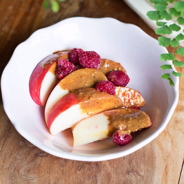 -Sliced-apple-dipped-in-almond-butter-topped-with-fresh-raspberries-Have-a-lovely-