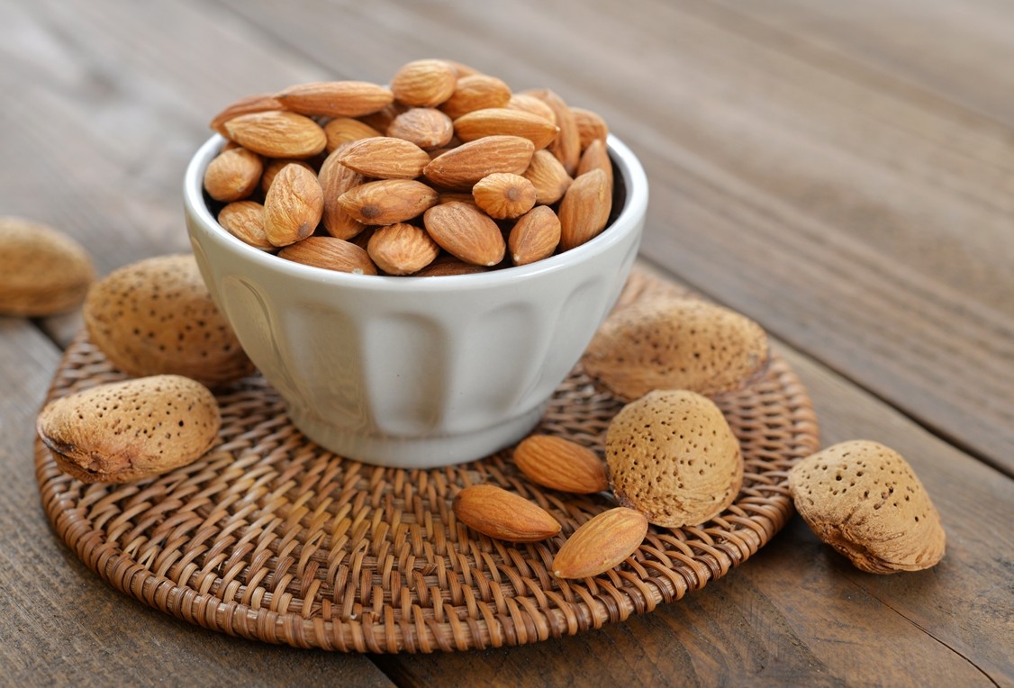 A-small-bowl-filled-with-fresh-Almonds.-Perfect-and-healthy-snack