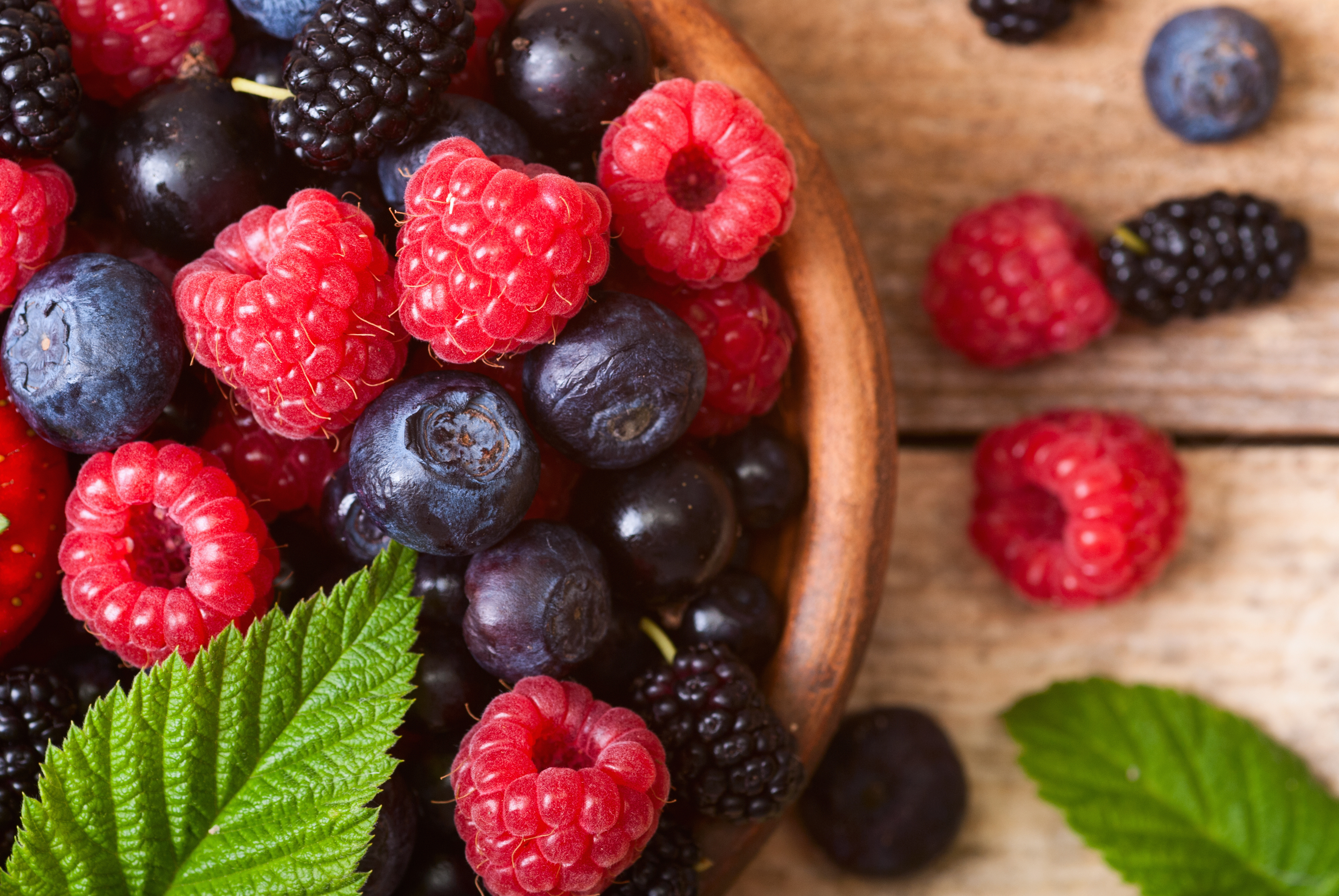 different fresh berries as background