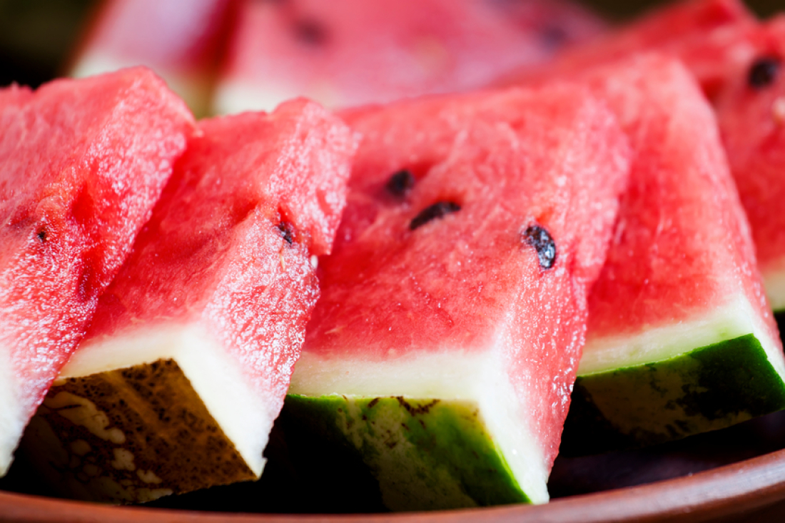 Watermelon slices on a clay plate, selective focus